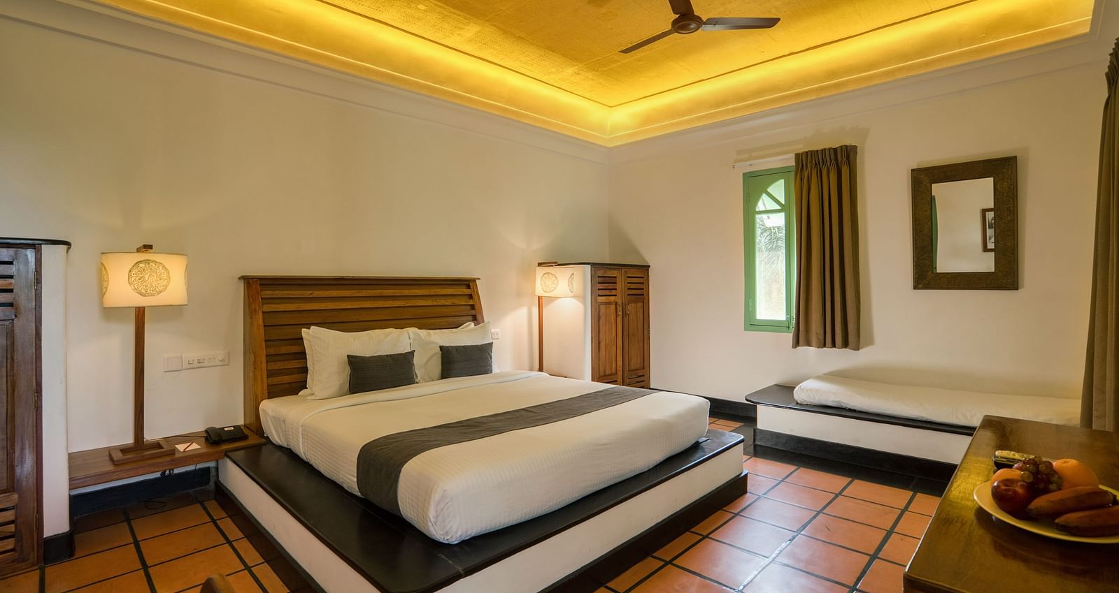 Suite Bedroom with a bed, table and a sofa.