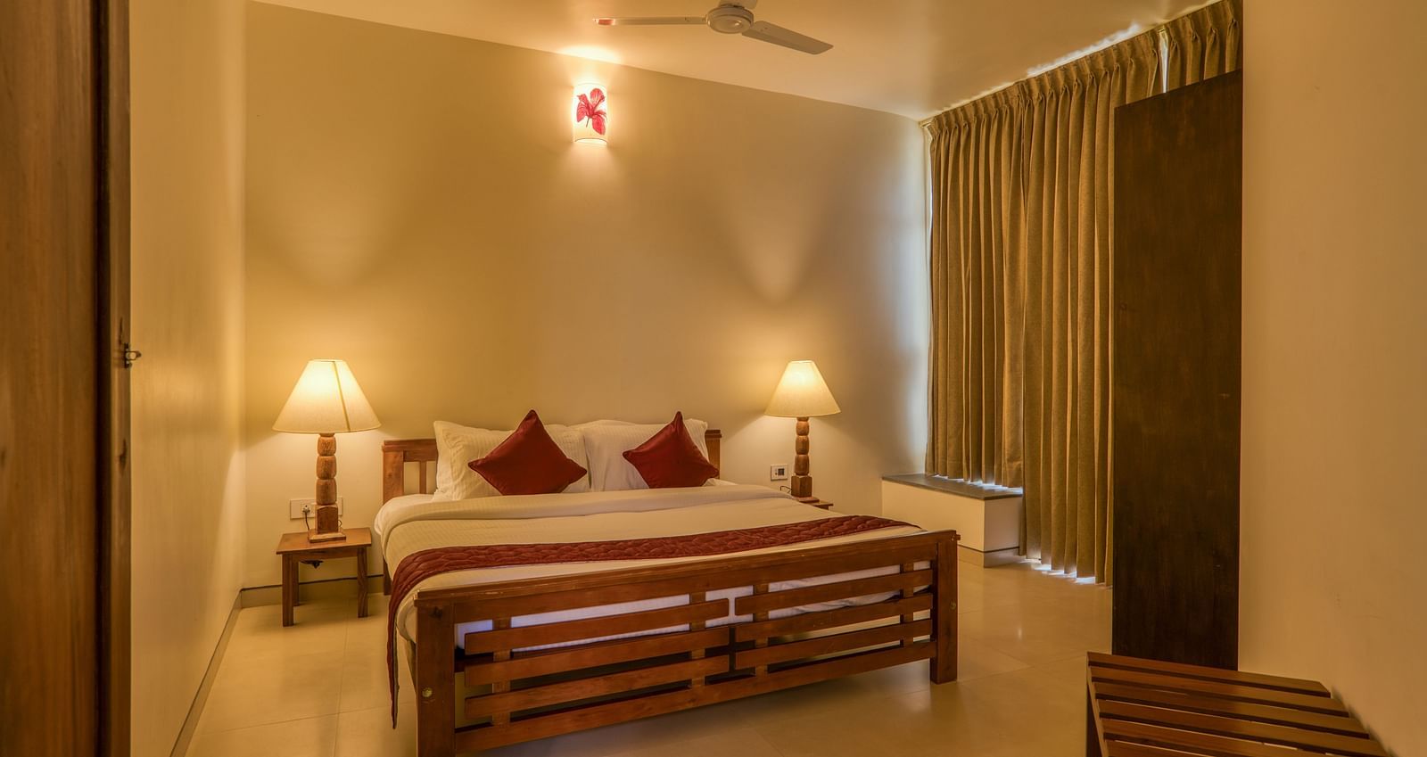 Cozy bedroom with a double bed, bedside lamps, and curtains  | Mango Hill, Yercaud