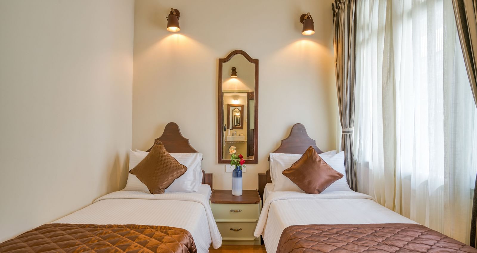 Twin beds inside the bedroom villa with a balcony | Mango Hill Shola Ooty