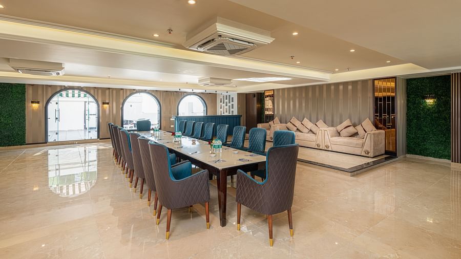 Image of the banquet hall with chairs and tale set up in a boardroom setting - DLS Grand Luxotica, Dehradun