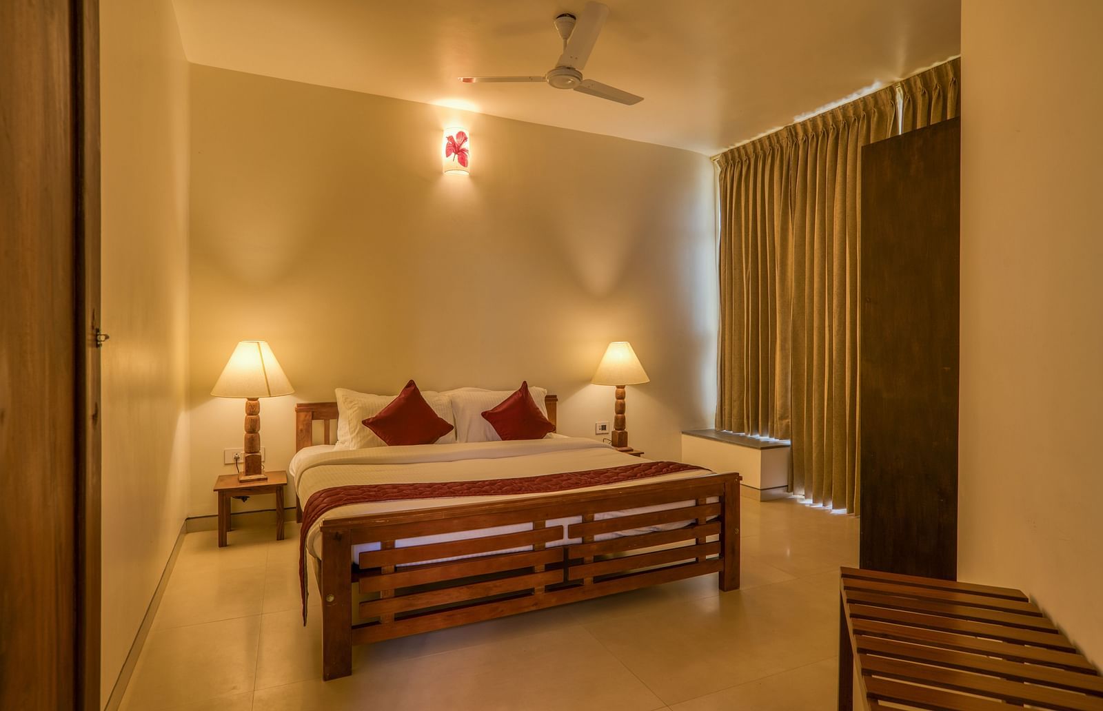 Cozy bedroom with a double bed, bedside lamps, and curtains  | Mango Hill, Yercaud