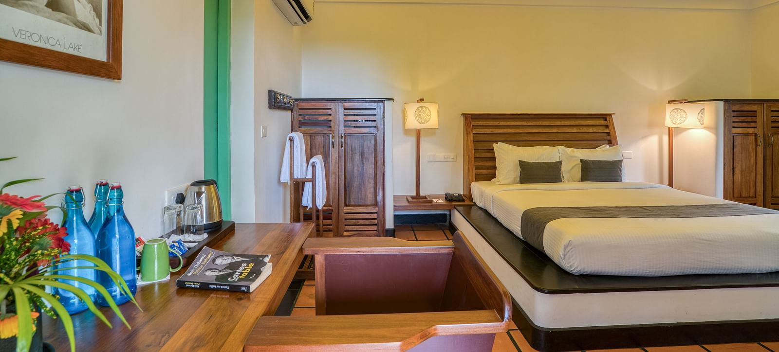 Suite Bedroom with a bed, table and a sofa.