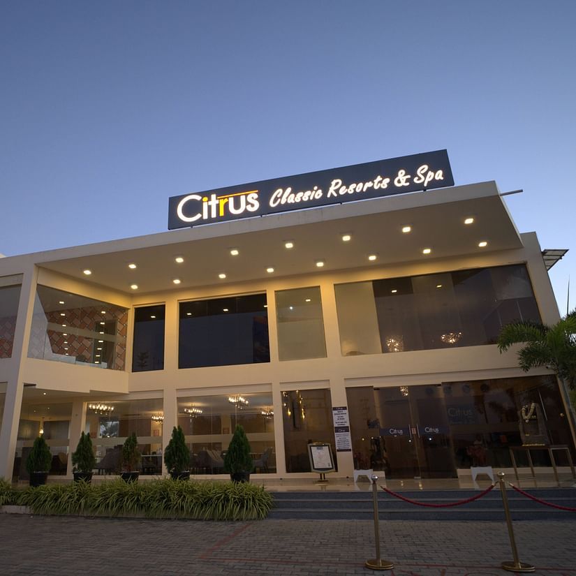Facade of Citrus Classic Resorts and Spa Mahabalipuram ECR with the building lit up with warm lights giving a proper view of the building