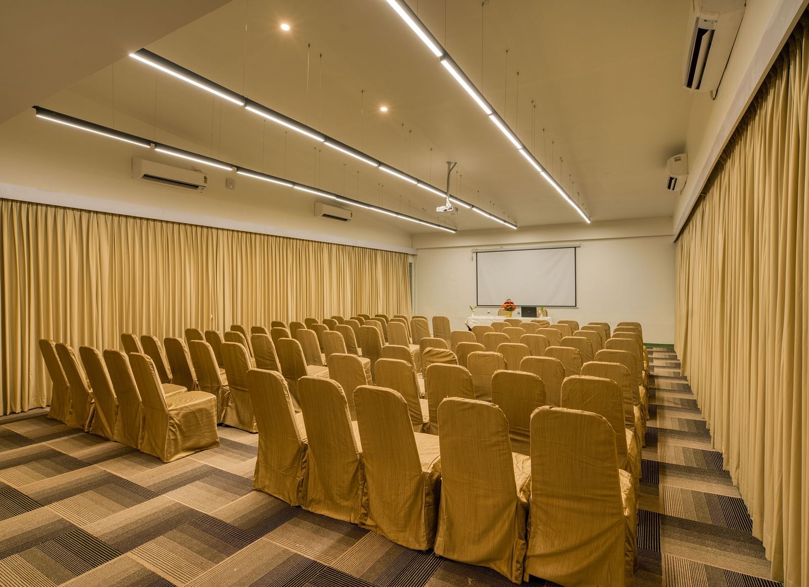 Side view of Banquet hall with  golden chairs.