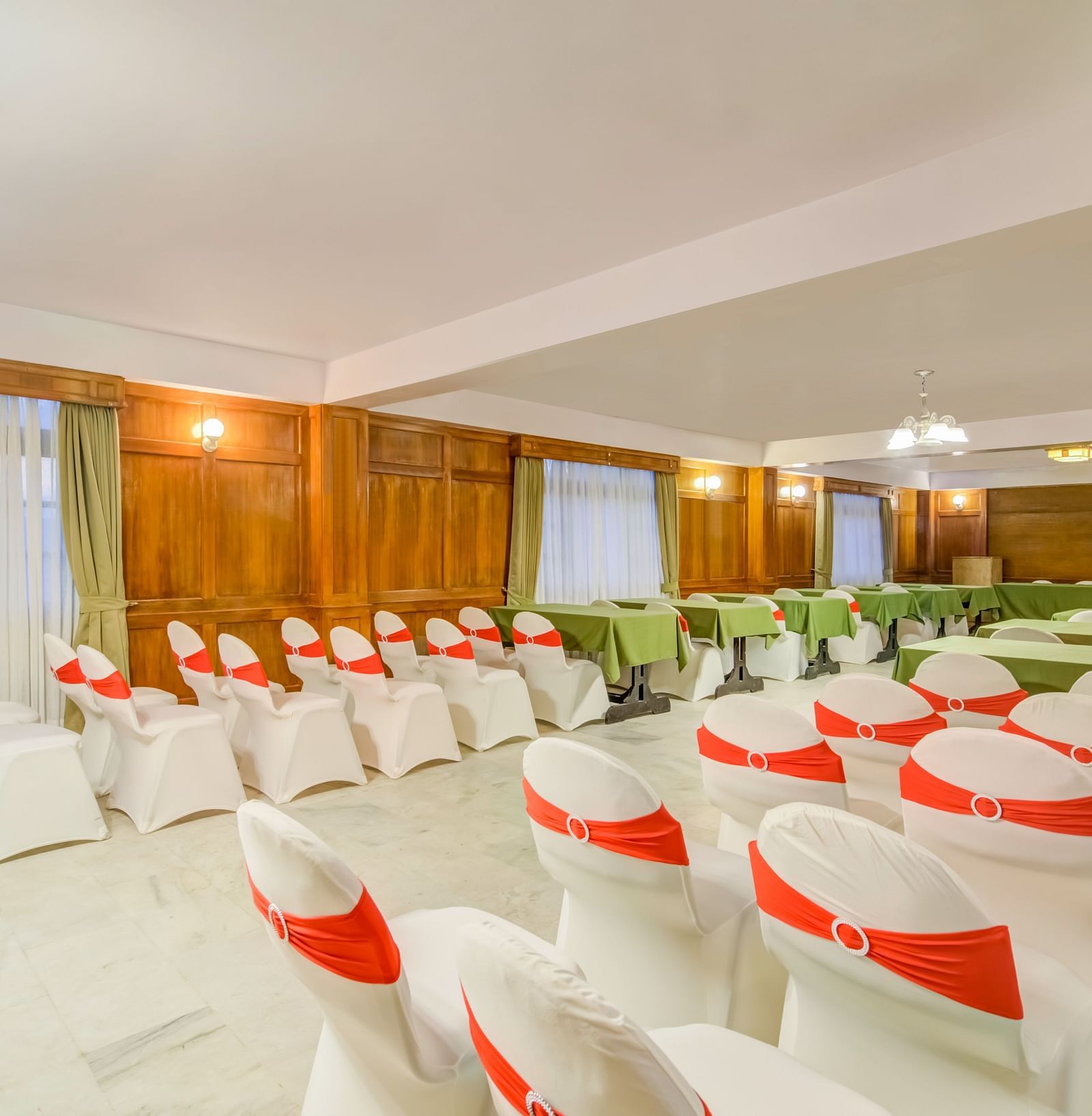 Image of a banquet hall with chairs neatly placed at Summit Tashi Ghang Heritage Resort, Pelling
