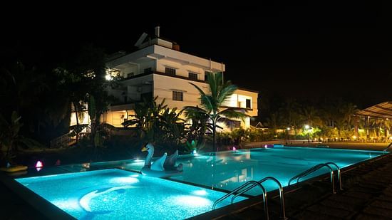 Swimming pool in view with light on during the night - Mastiff Select Terrain