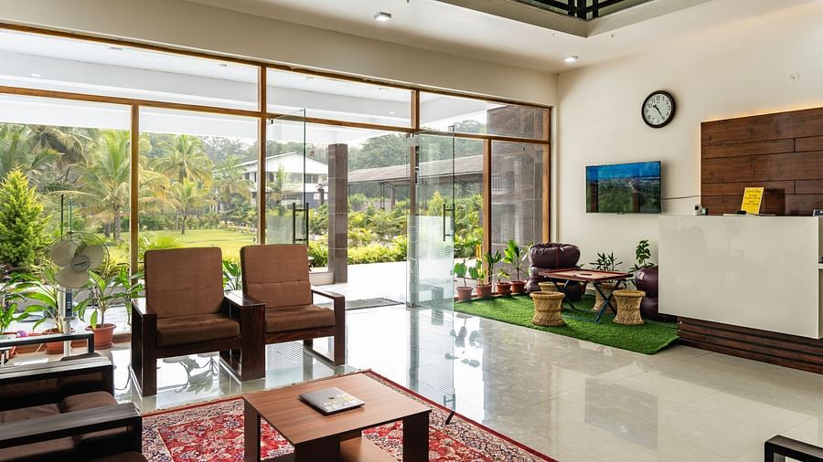 sitting area with a desk on the right inside the indoor sports room - Mastiff Select Terrain