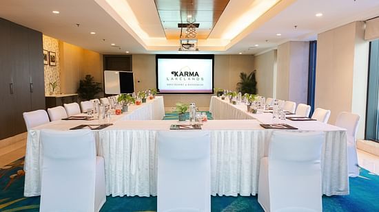 Rectangle seating arrangement with a tv in front during a Conference Corporate Event - Karma Lakelands.