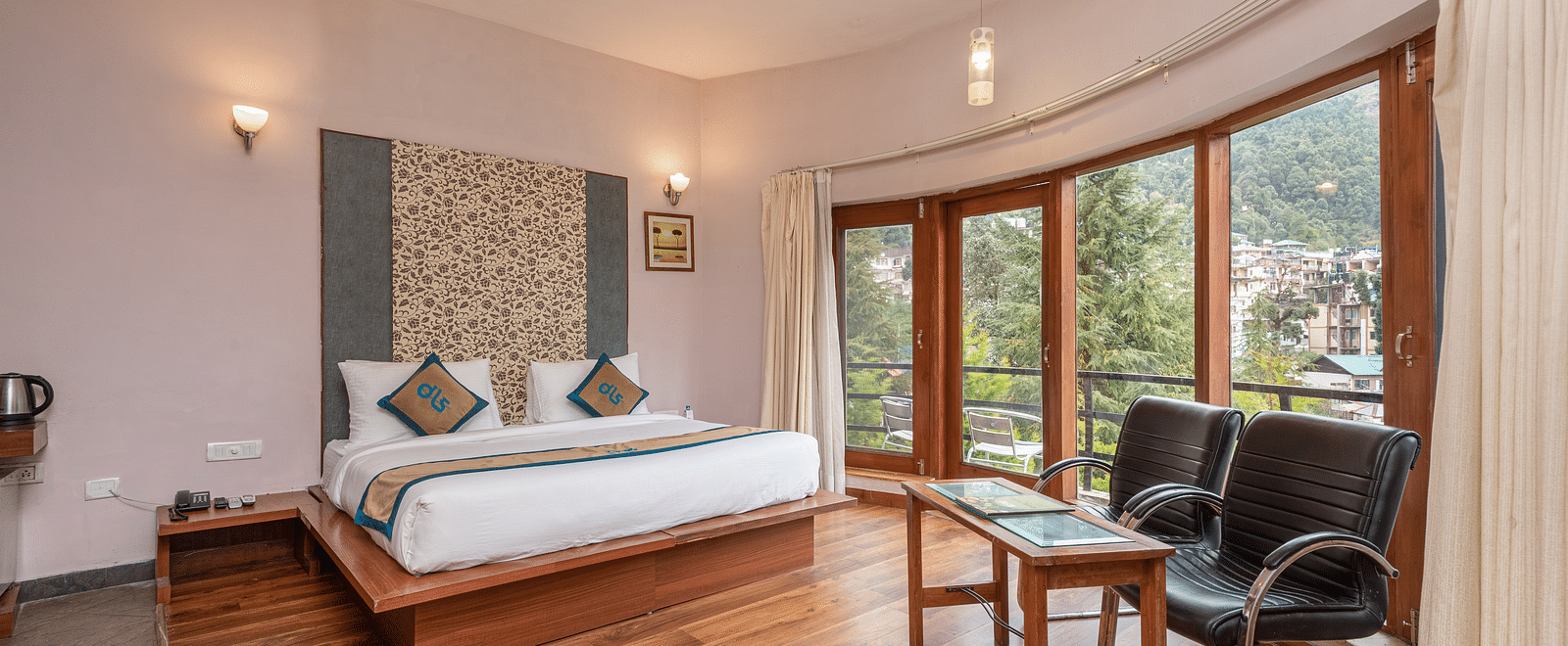 Overview of Luxury Cottage at DLS Spring Valley Resort Dharamshala featuring a king size bed, table , chairs,and a big balcony