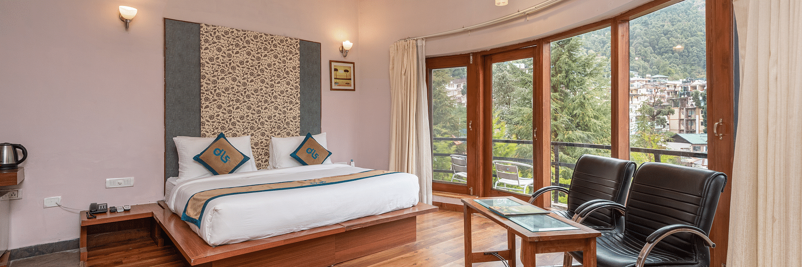 Overview of Luxury Cottage at DLS Spring Valley Resort Dharamshala featuring a king size bed, table , chairs,and a big balcony