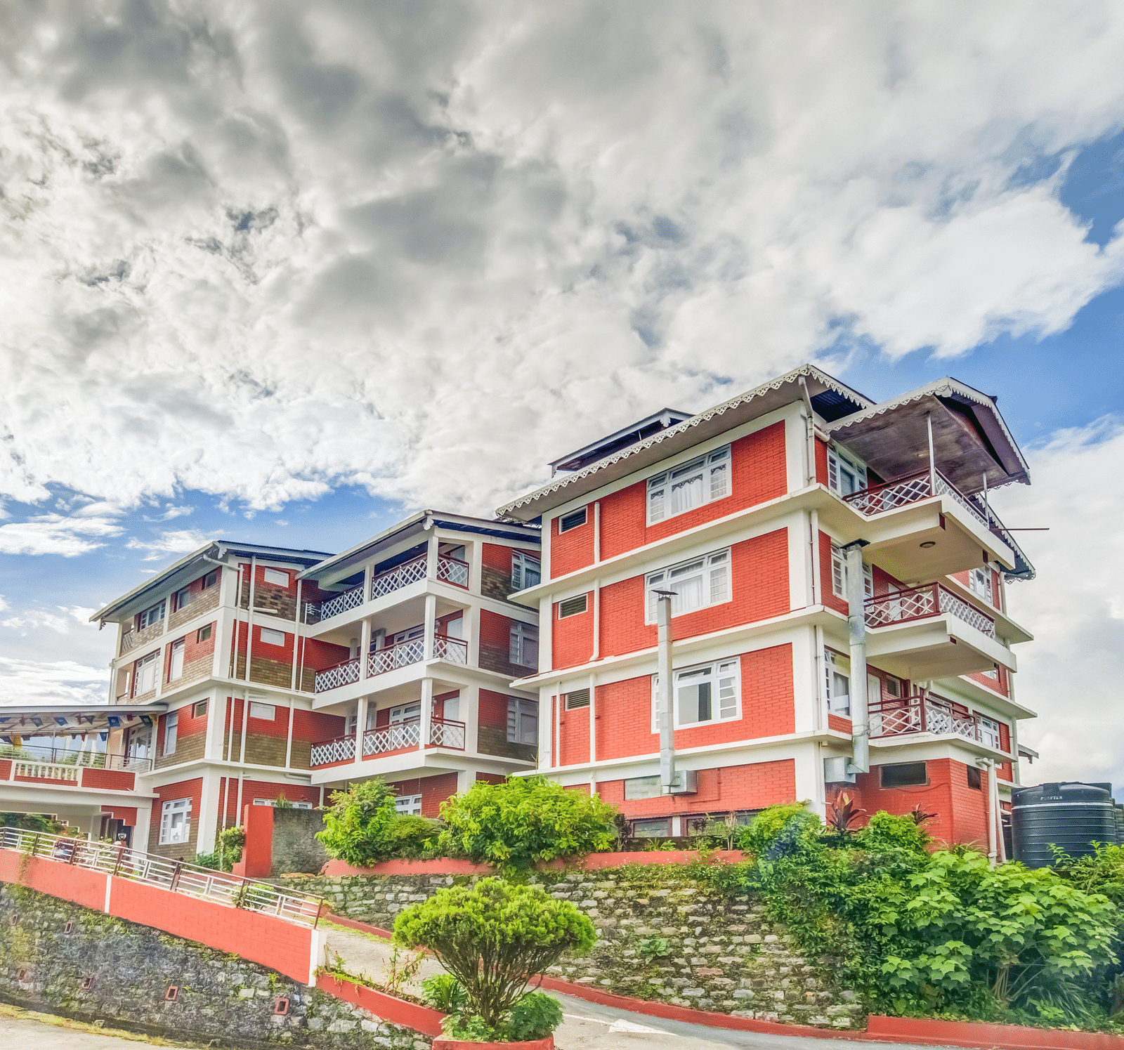 Facade of Summit Tashi Ghang Heritage Resort, Pelling surrouned by greenery