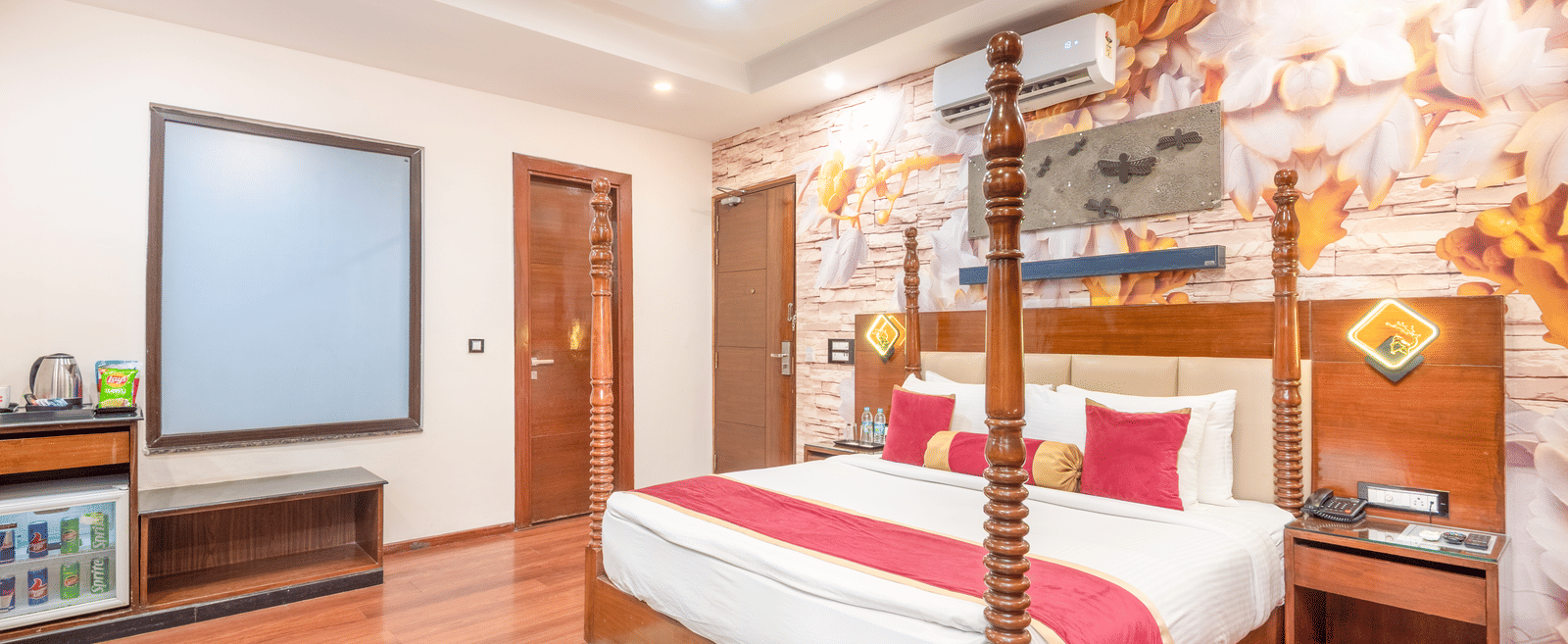 Spacious double bed room with wooden flooring at DLS Hotels On The Ganges.