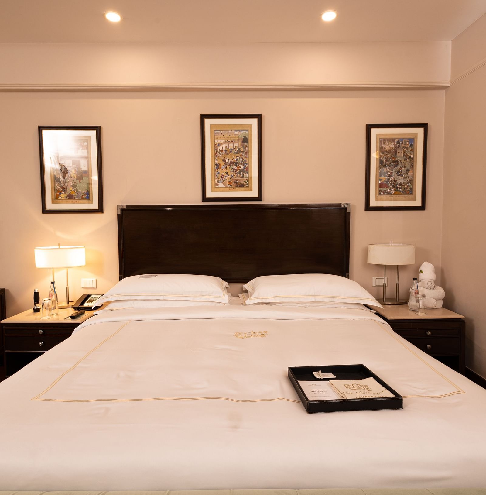 image of the king size bed with white sheets at the heritage balcony room - image of the heritage balcony room with sleek interiors and a a plush king size bed - The Claridges New Delhi