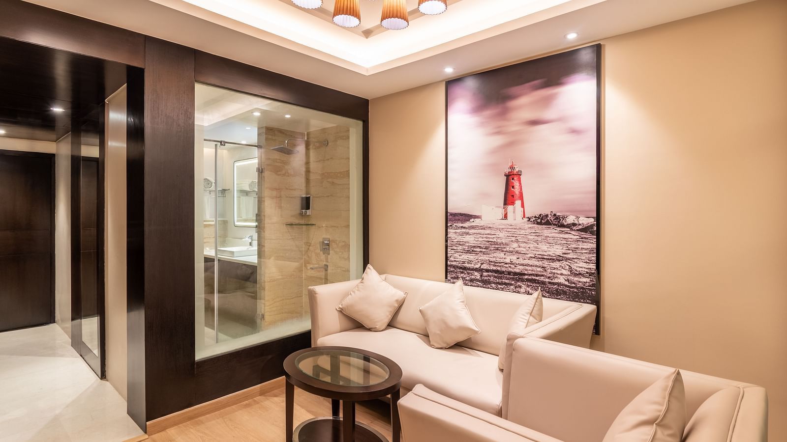 Spacious hotel suite with modern seating area and wall art fortuna- TGI Grand Fortuna, Krishnagiri Main Road, Hosur