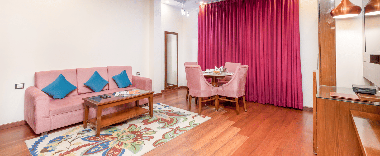Suite with sofa seating and wooden flooring at DLS Hotels On The Ganges.