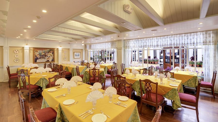 indoor seating space at the restaurant - Mayfair Hill Resort, Darjeeling 6