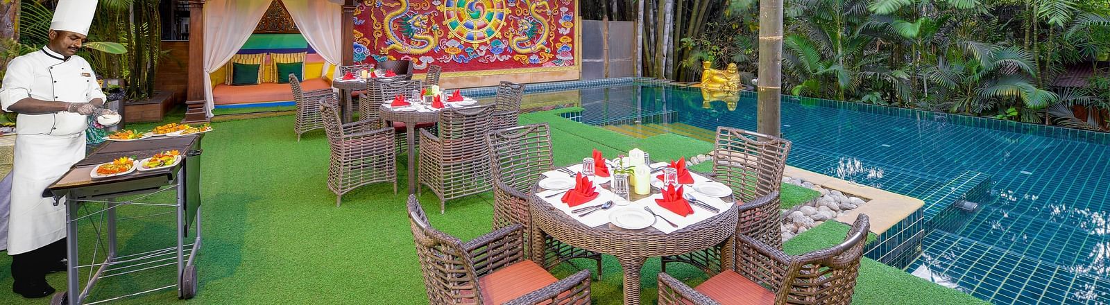 seating space and a barbecue set-up by the pool - Mayfair Spa Resort & Casino Gangtok 