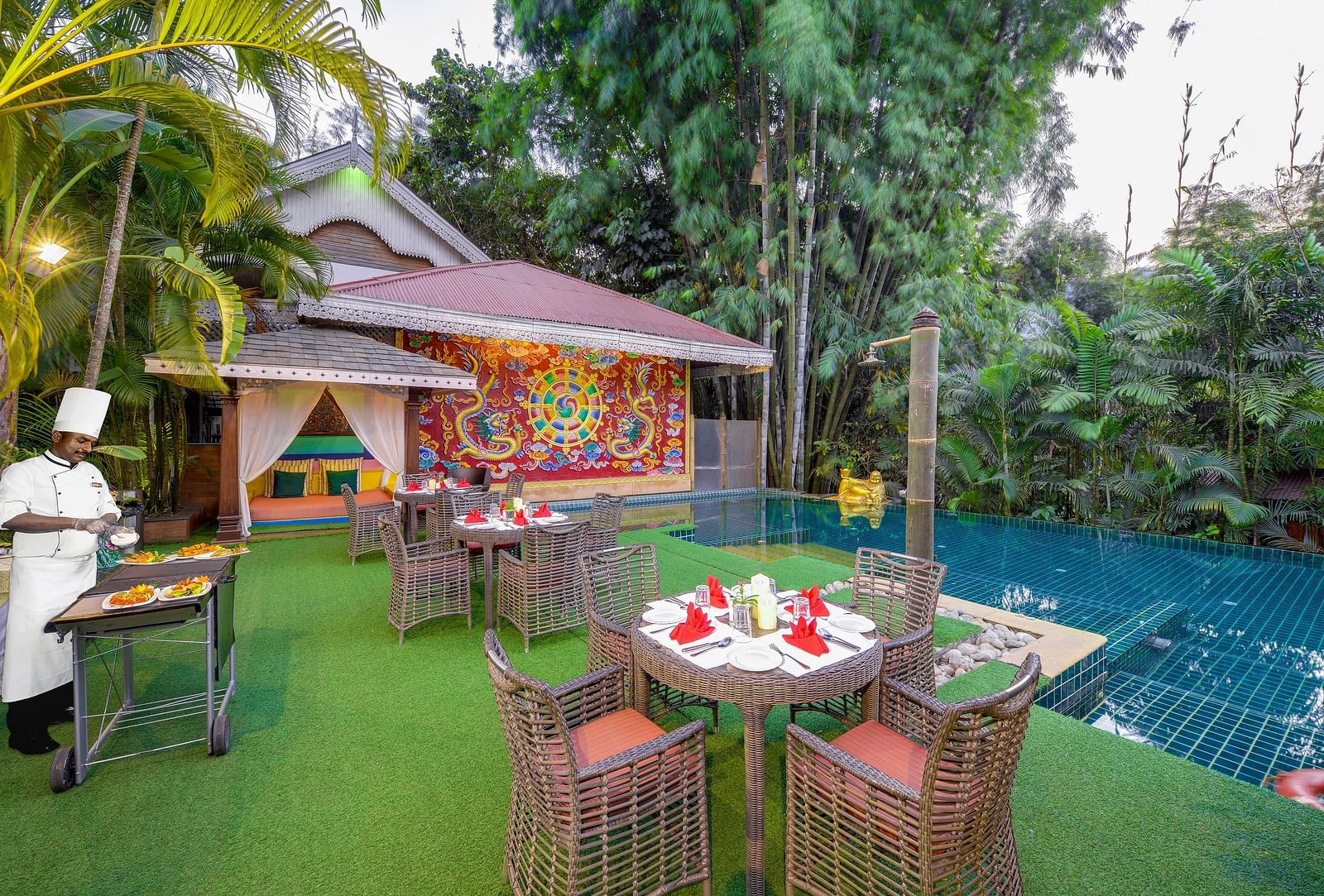 seating space and a barbecue set-up by the pool - Mayfair Spa Resort & Casino Gangtok 