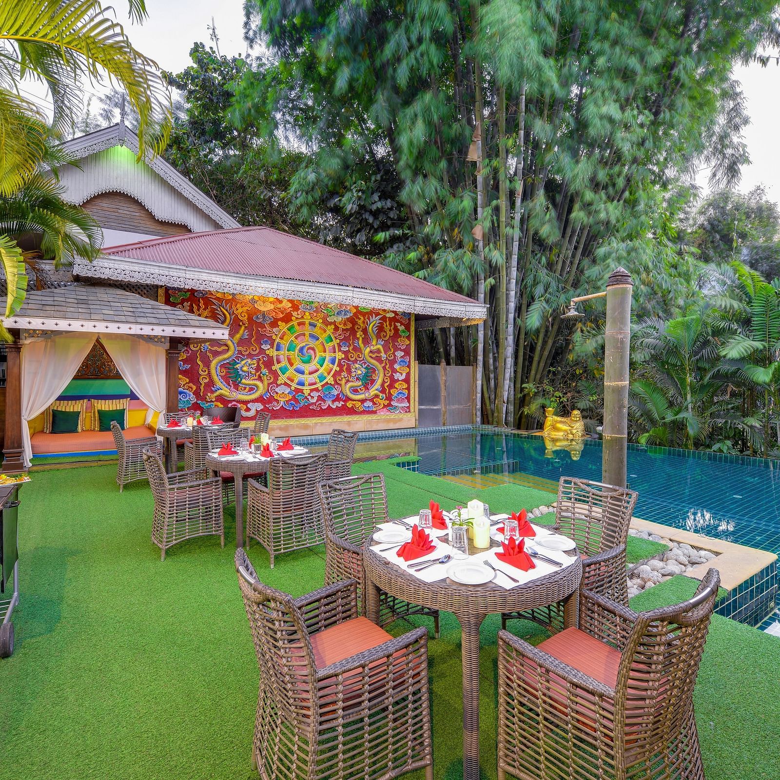 seating space and a barbecue set-up by the pool - Mayfair Spa Resort & Casino Gangtok 