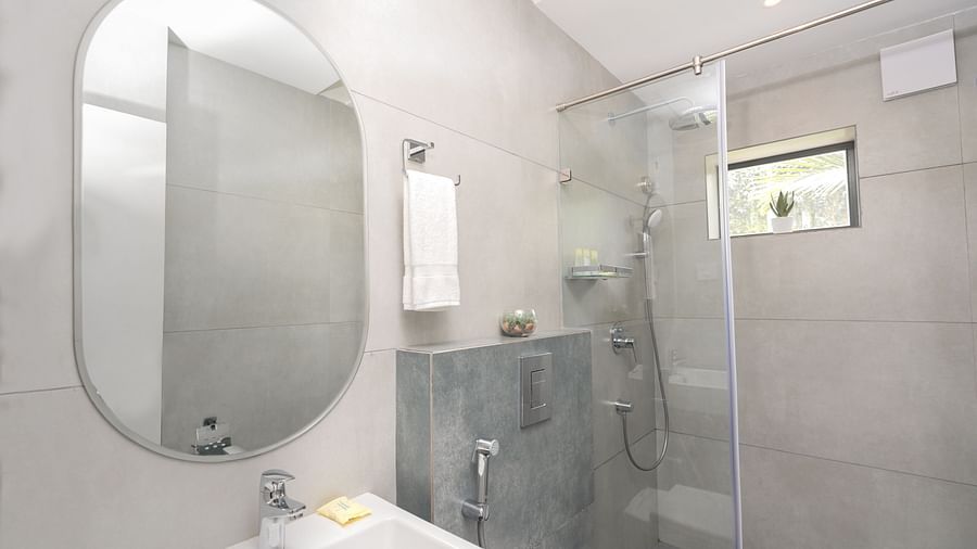 image highlighting the a mirror above the wash basin in the premium room bathroom - Darza Resorts
