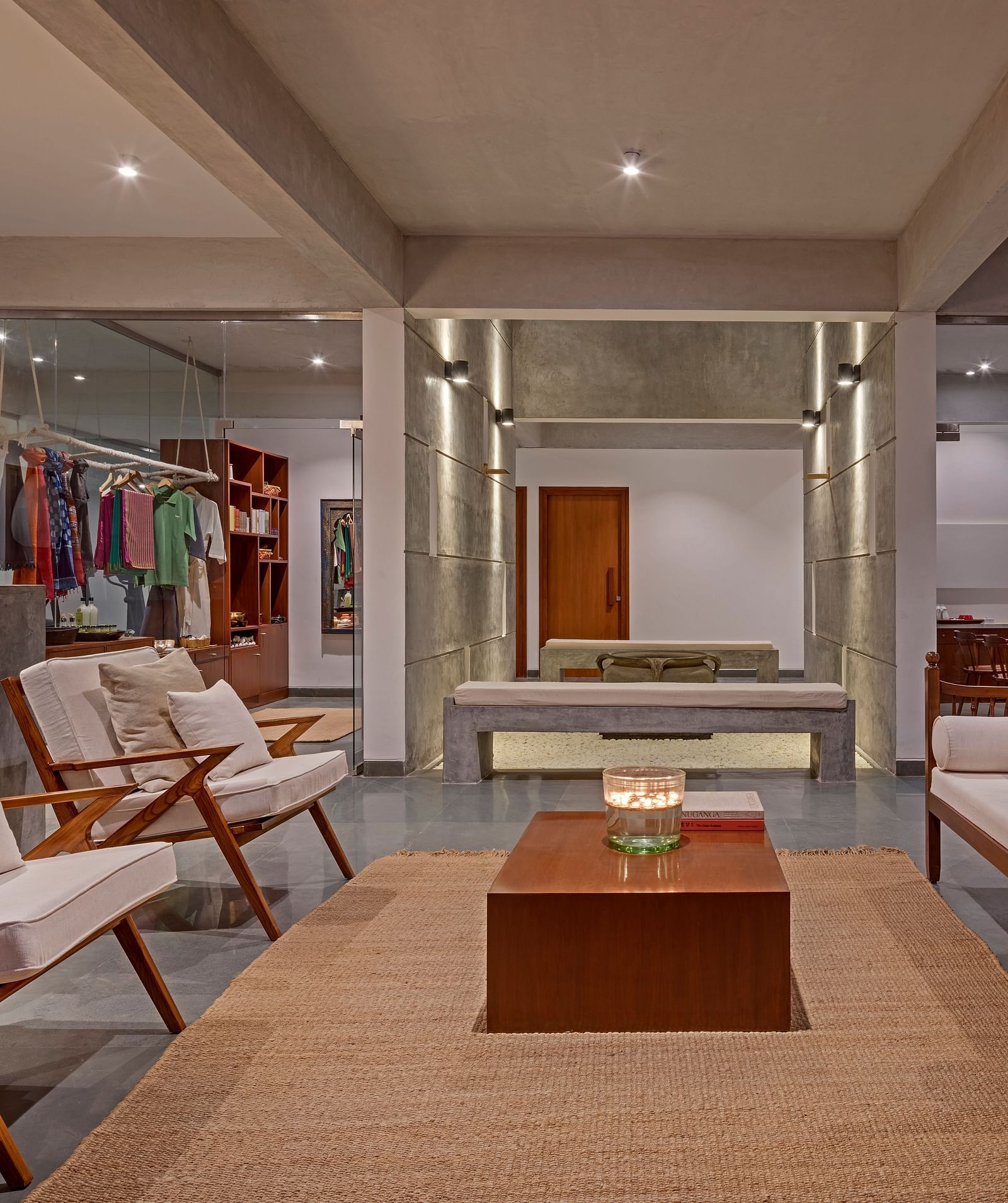 Living room with wooden furniture, rug, and decorative items, spacious interior - Shreyas Retreat