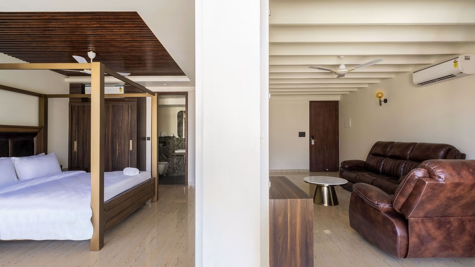 Overview of the living room and bedroom in view inside one of the rooms - The Tanisi Hotels & Resorts, Goa