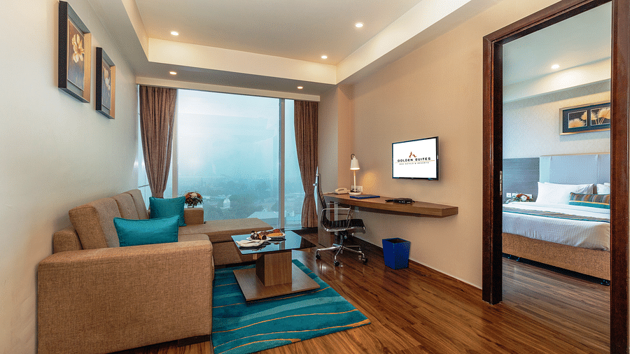 A corner view of the living room along with the bedroom at glden suite
