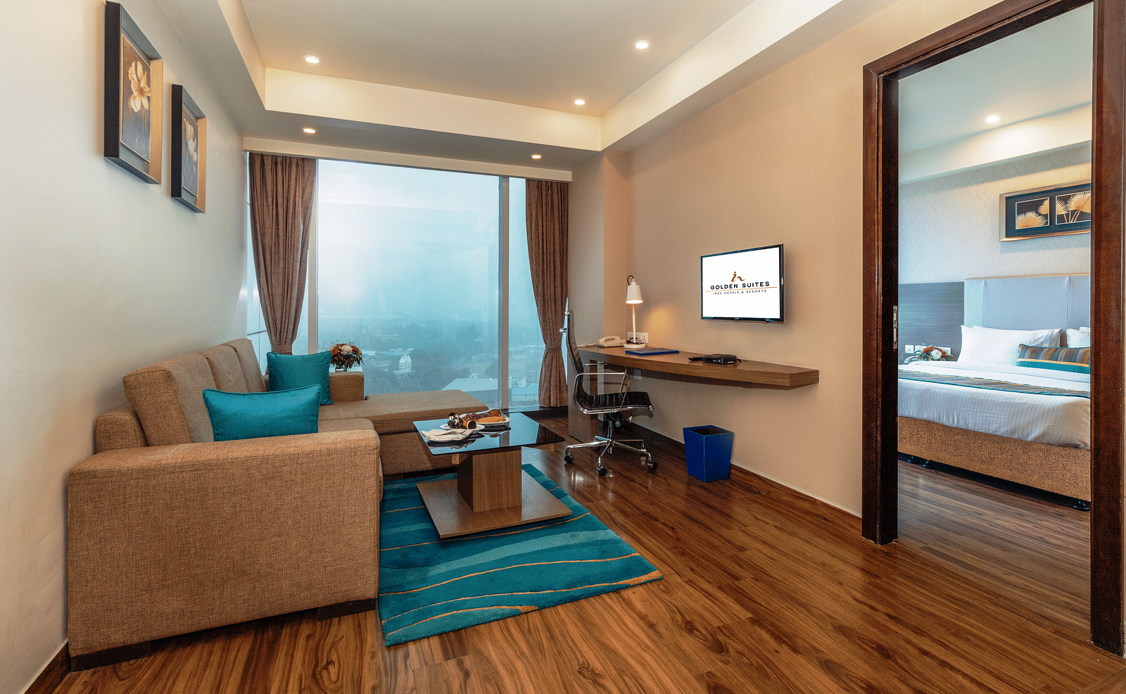 A corner view of the living room along with the bedroom at glden suite