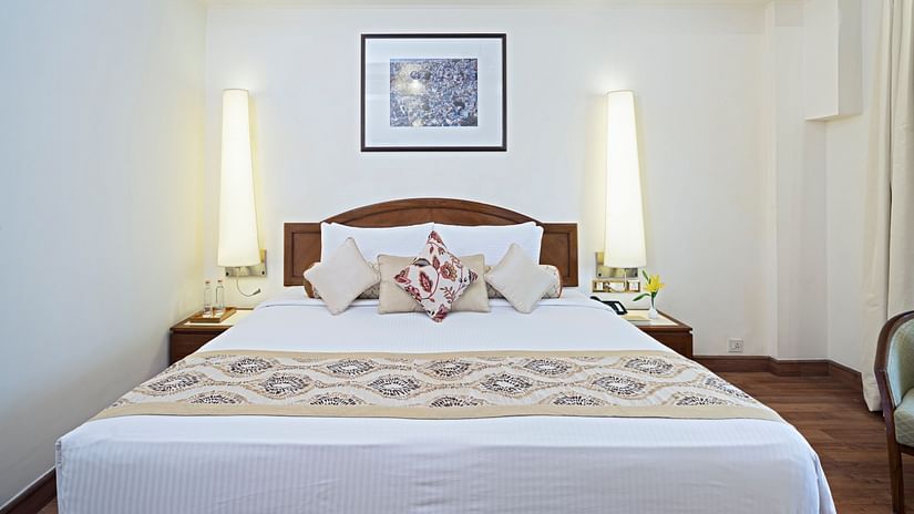 The comfortable bed with fluffy pillows and elegant beddings at our Superior Rooms