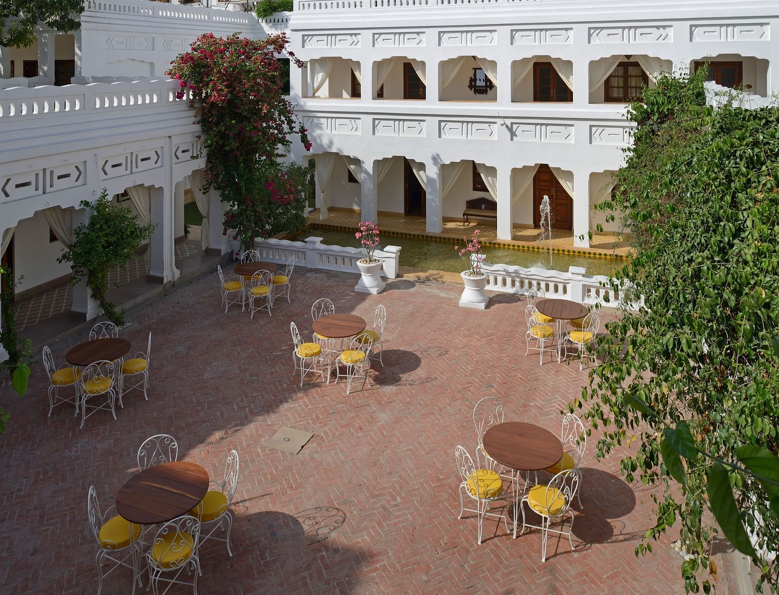 Aerial view of the hall Sehen with chairs and tables in view - Saraca Hotel Lucknow.
