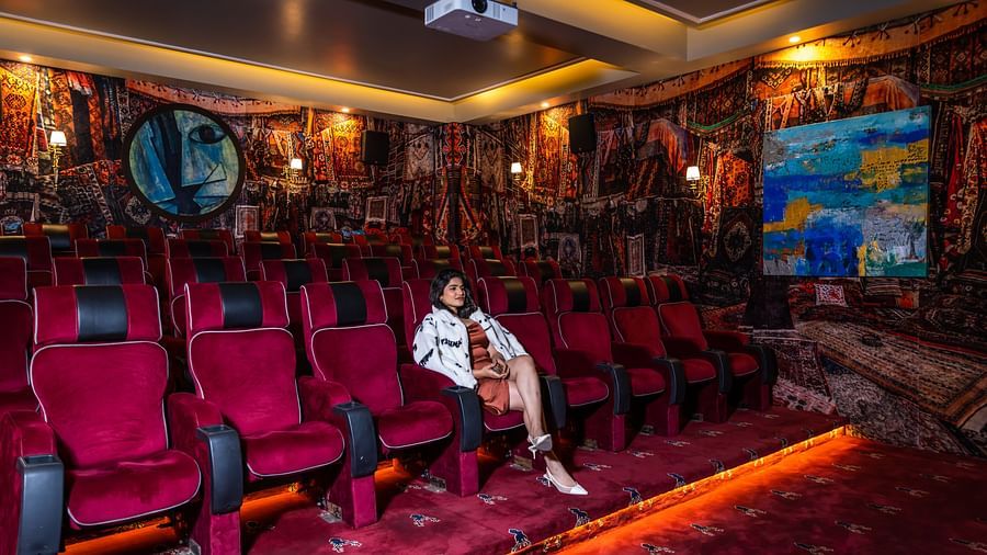 A person enjoying a movie in our private theatre  - The Manor Luxury Hotel, Shimla