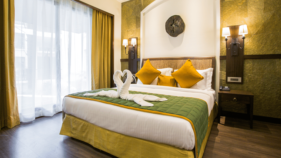 A room at Rhythm Lonavala with clean sheets and pillows on it.