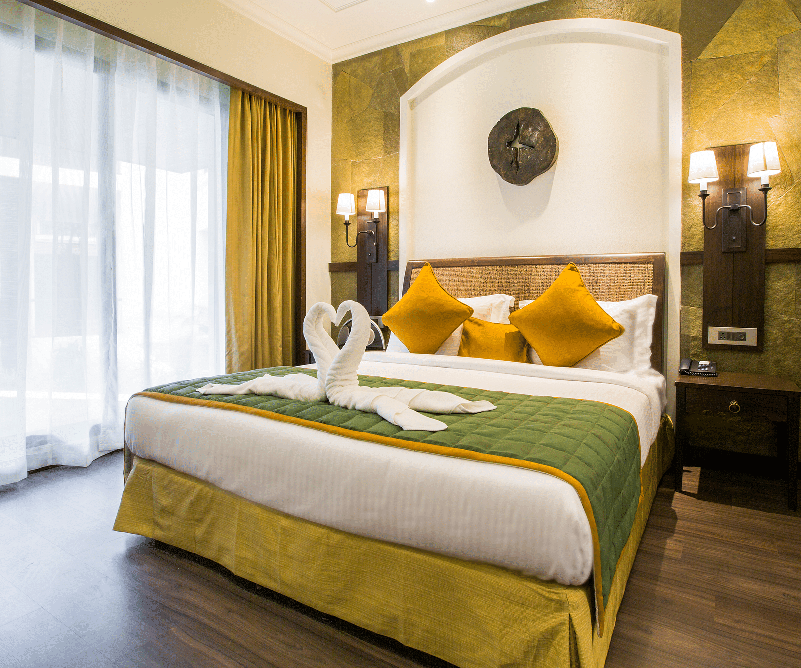 an overview of a room with clean sheets and pillows on it inside one of the rooms - Rhythm Lonavala