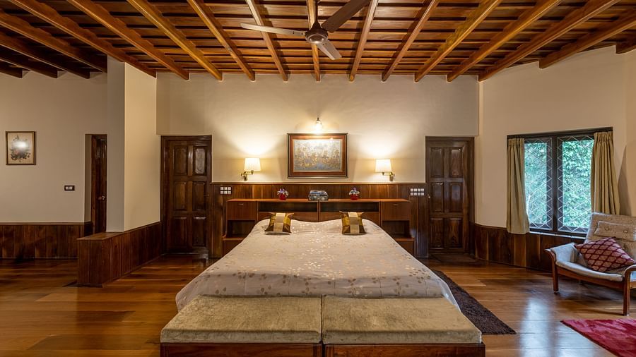 A view of the twin-bedded room showing more of the wooden ceiling and decor - BluSalzz Collection - Tranquil Resort, Wayanad