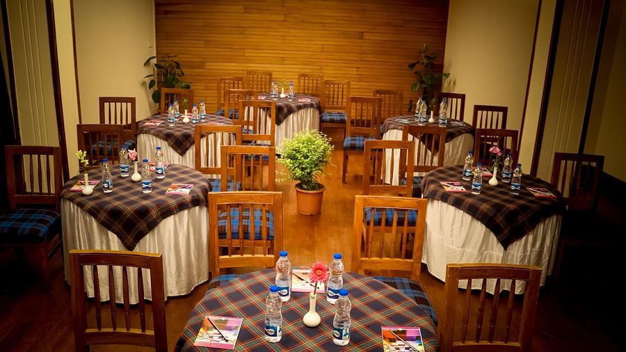 Round-table banquet setup at the hotel’s event hall, ideal for intimate gatherings and business meetings - cedar inn