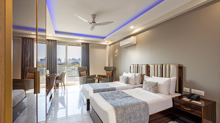 Picture of Cozy hotel room with two comfortable bed and soft curtains.