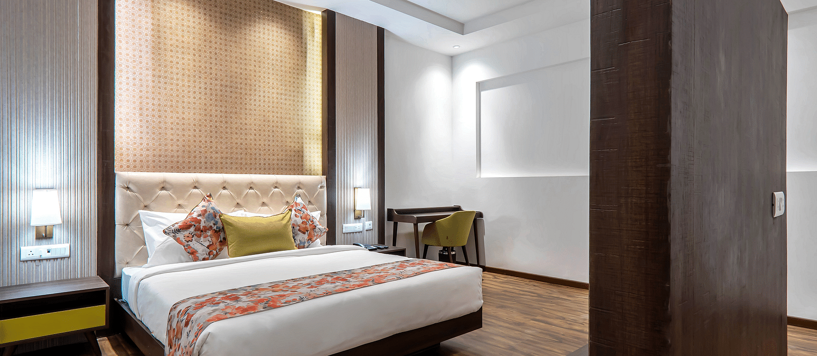 Family Room at Hotel Le ROI Lake View Koti with a sperated TV cabinet and a posh bed for a cosy stay1