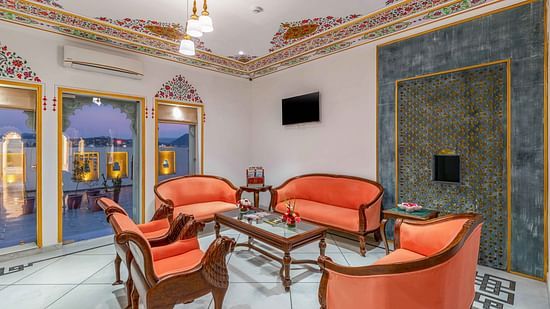 Travel Desk at Maan Vilas by Stone Wood, Udaipur with sofas and coffee table