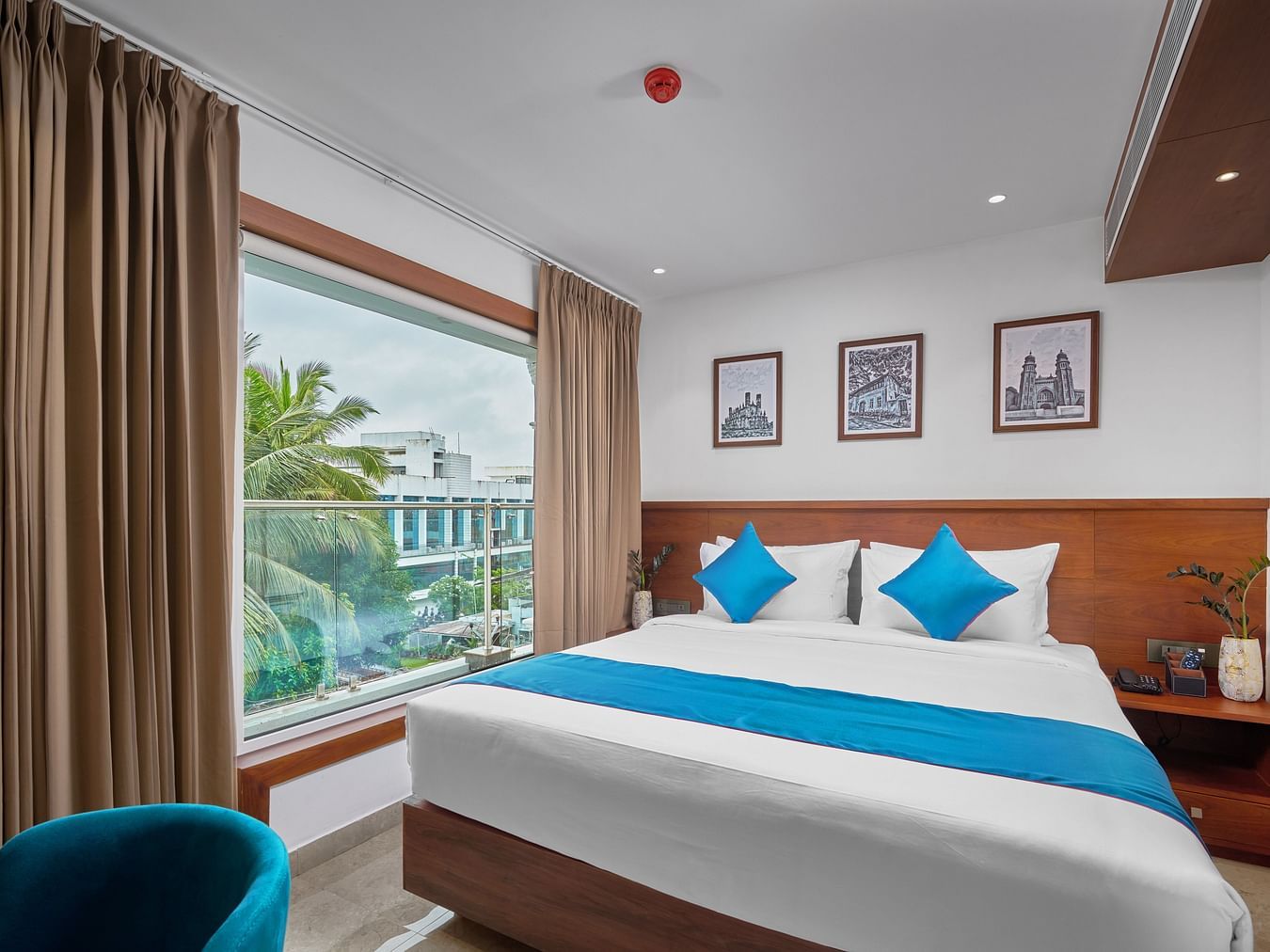 Image of the superior room with a expansive room and sofa along with king size bed.
