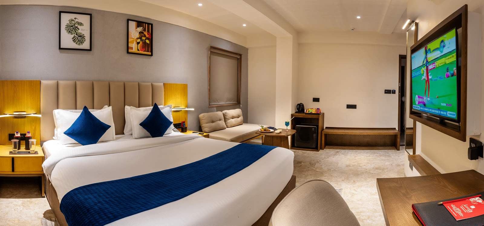 Luxury accommodation with plush bedding and spacious layout at Lords Studio Inn, Jamnagar.