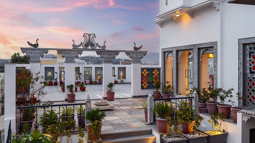 A serene and tranquil space adorned with decor and plants at Maan Vilas by Stone Wood, Udaipur