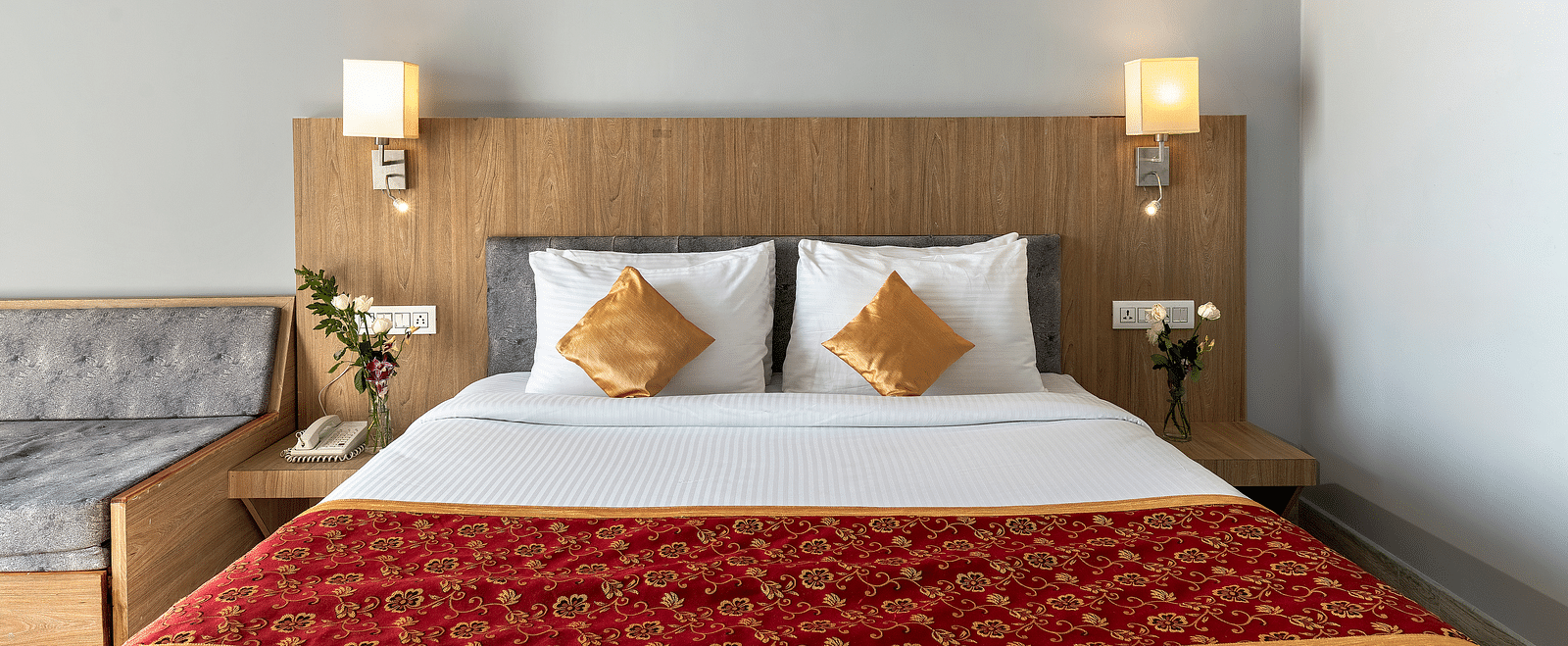 Close-up shot of a bed with two pillows on it and two lamps kept on both sides of the bed - Via Lakhela Resort & Spa, Kumbhalgarh 