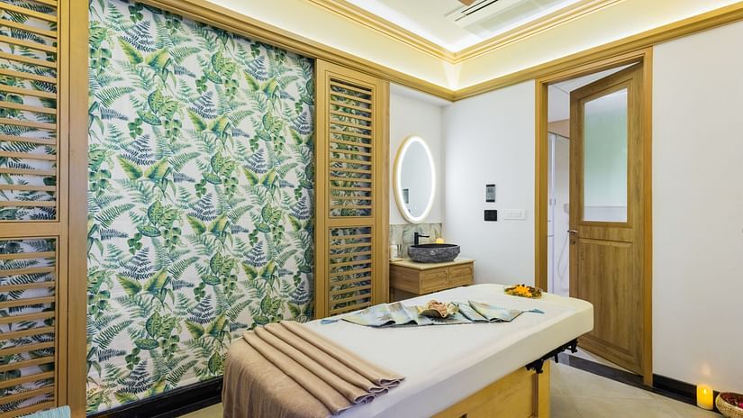 An overview of a room at Aruna Spa with a massage bed in the centre - Heritage Village Resorts & Spa, Goa.