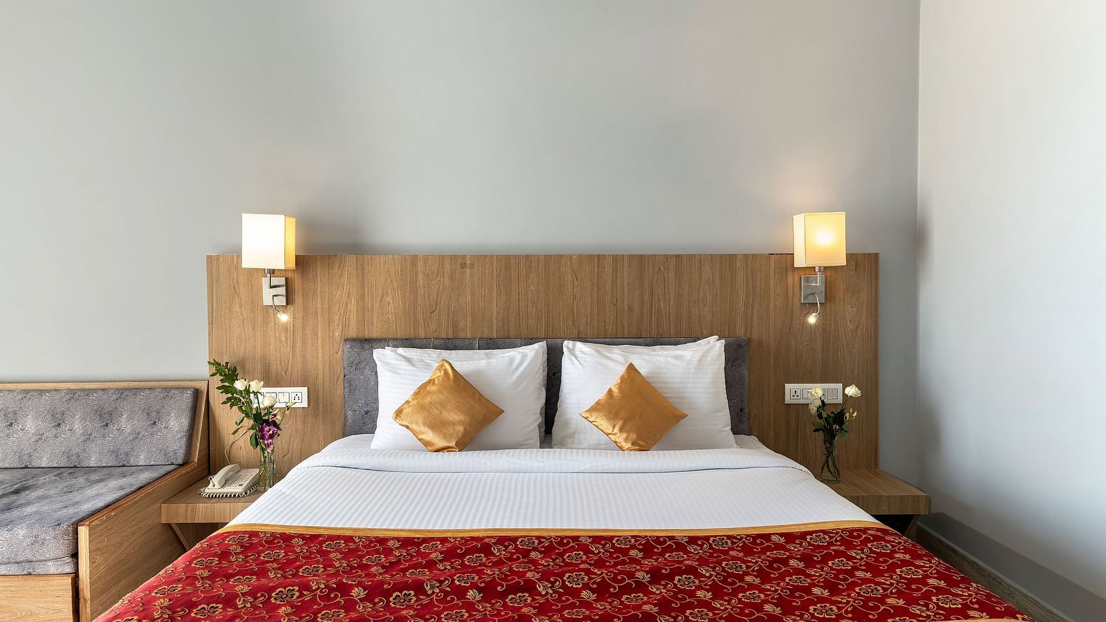 Close-up shot of a bed with two pillows on it and two lamps kept on both sides of the bed - Via Lakhela Resort & Spa, Kumbhalgarh 