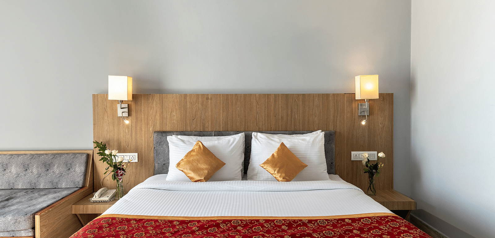 Close-up shot of a bed with pillows on it and two lamps kept on both sides of the bed - Via Lakhela Resort & Spa, Kumbhalgarh 