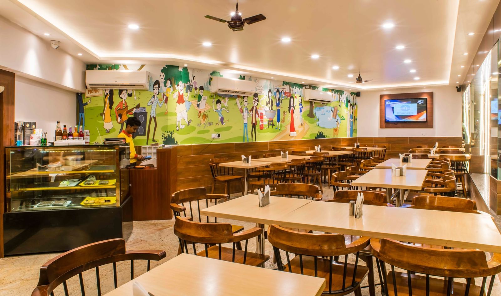 The interior of a brightly lit dining area or restaurant at The Citi Residenci Hotel, Durgapur.