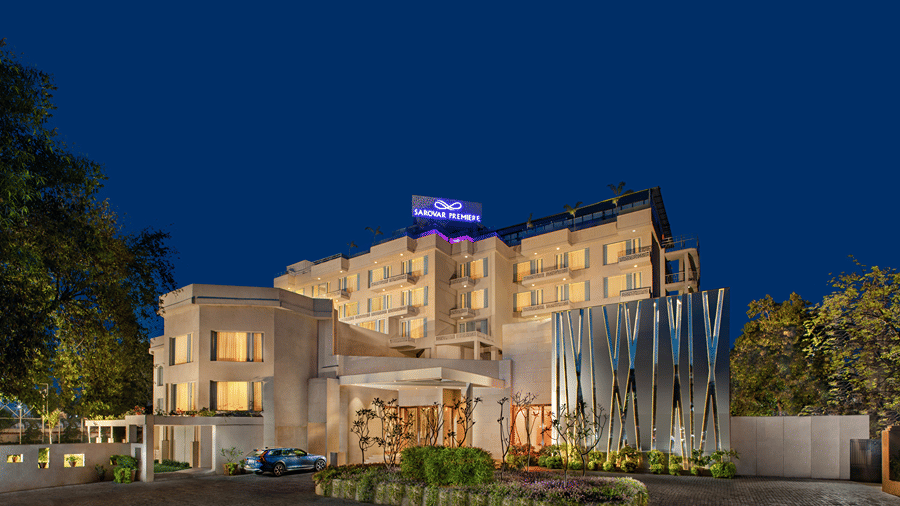 Illuminated facade with night sky in the backdrop.