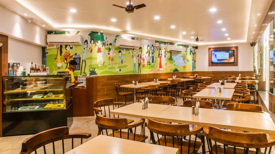 The interior of a brightly lit dining area or restaurant at The Citi Residenci Hotel, Durgapur.