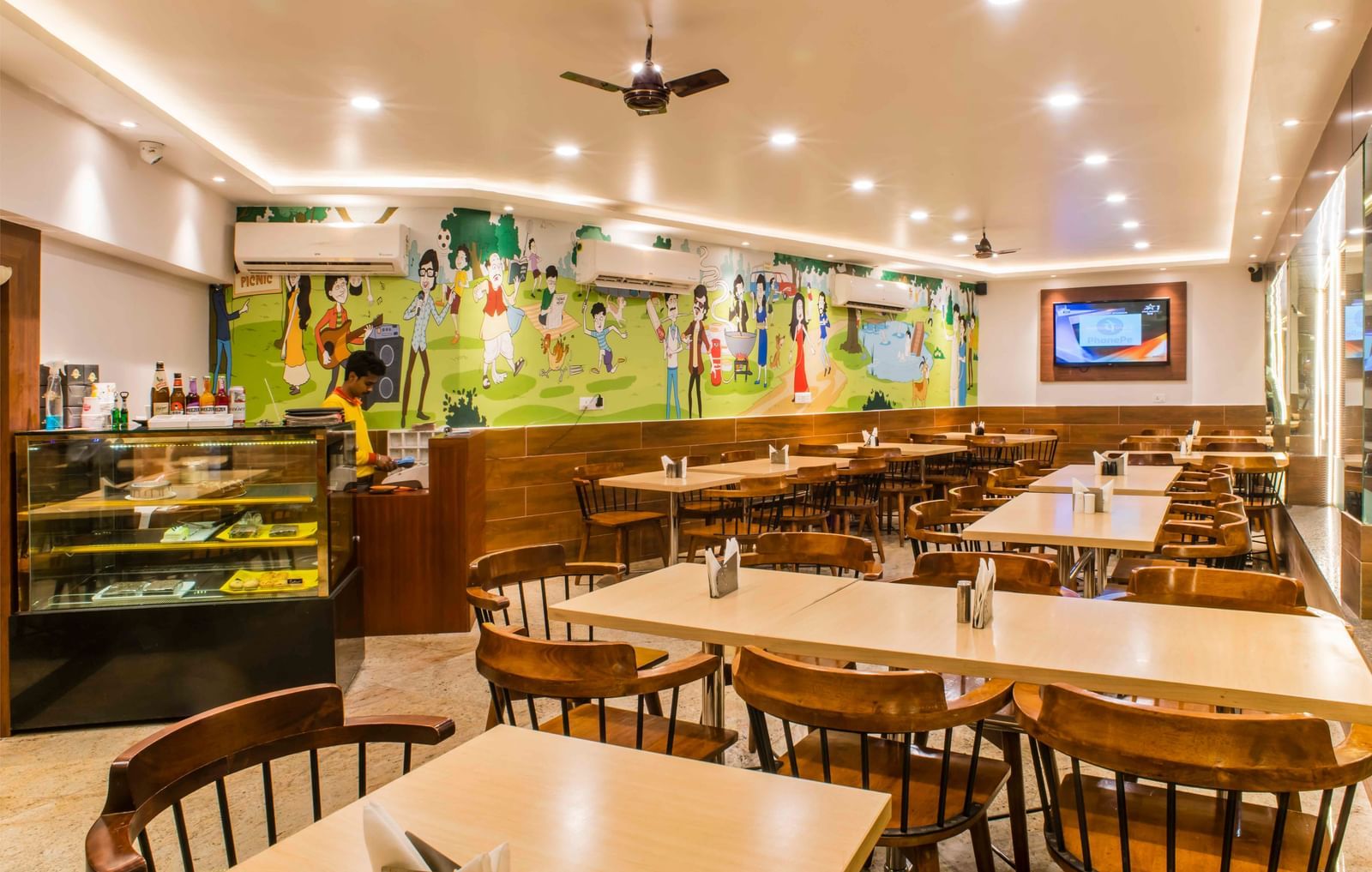 The interior of a brightly lit dining area or restaurant at The Citi Residenci Hotel, Durgapur.