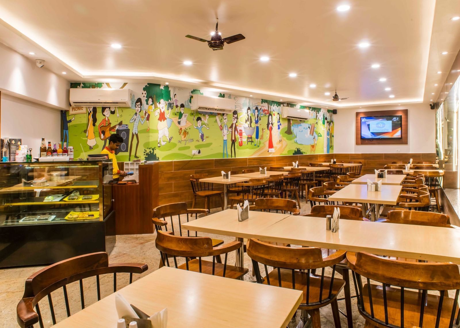 The interior of a brightly lit dining area or restaurant at The Citi Residenci Hotel, Durgapur.